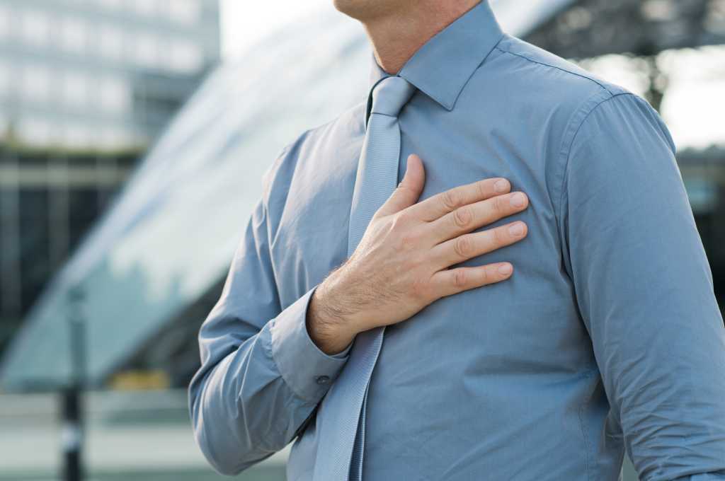 Closeup Of A Businessman With Hand On His Chest Outdoor