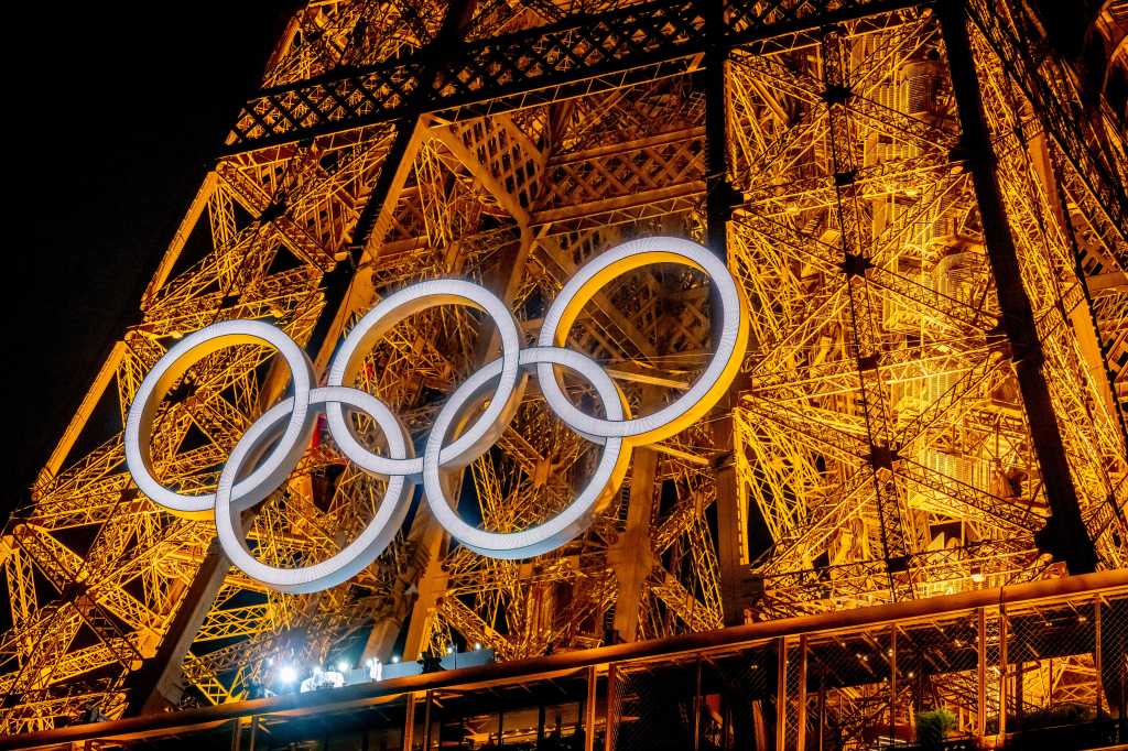 Paris Olympic rings on the the Eiffel Tower at night two days before the start of the Paris 2024 Olympics, on July 24, 2024.