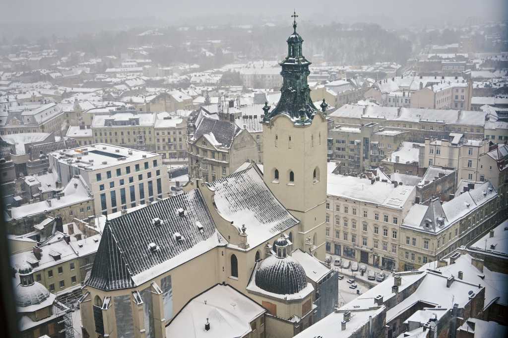 The cityscape opens from the tower of the Lviv Town Hall in winter, Lviv, western Ukraine.