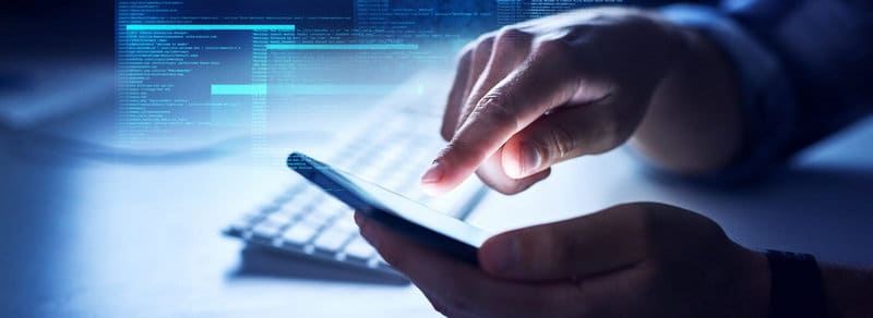 man hands interacting with a phone with a data overlay